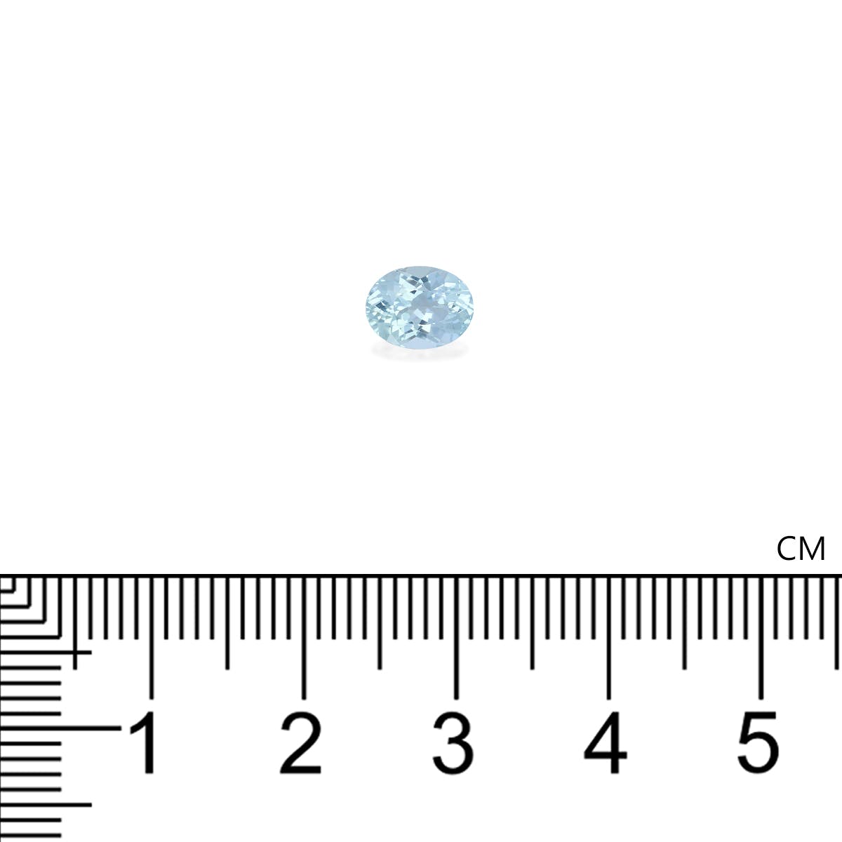 La tourmaline paraïba Bonnot Paris de 0,87 ct, une petite aigue-marine ronde, est placée au centre d'une règle graduée en centimètres. Son bleu clair met en valeur son diamètre d'environ 0,5 cm.