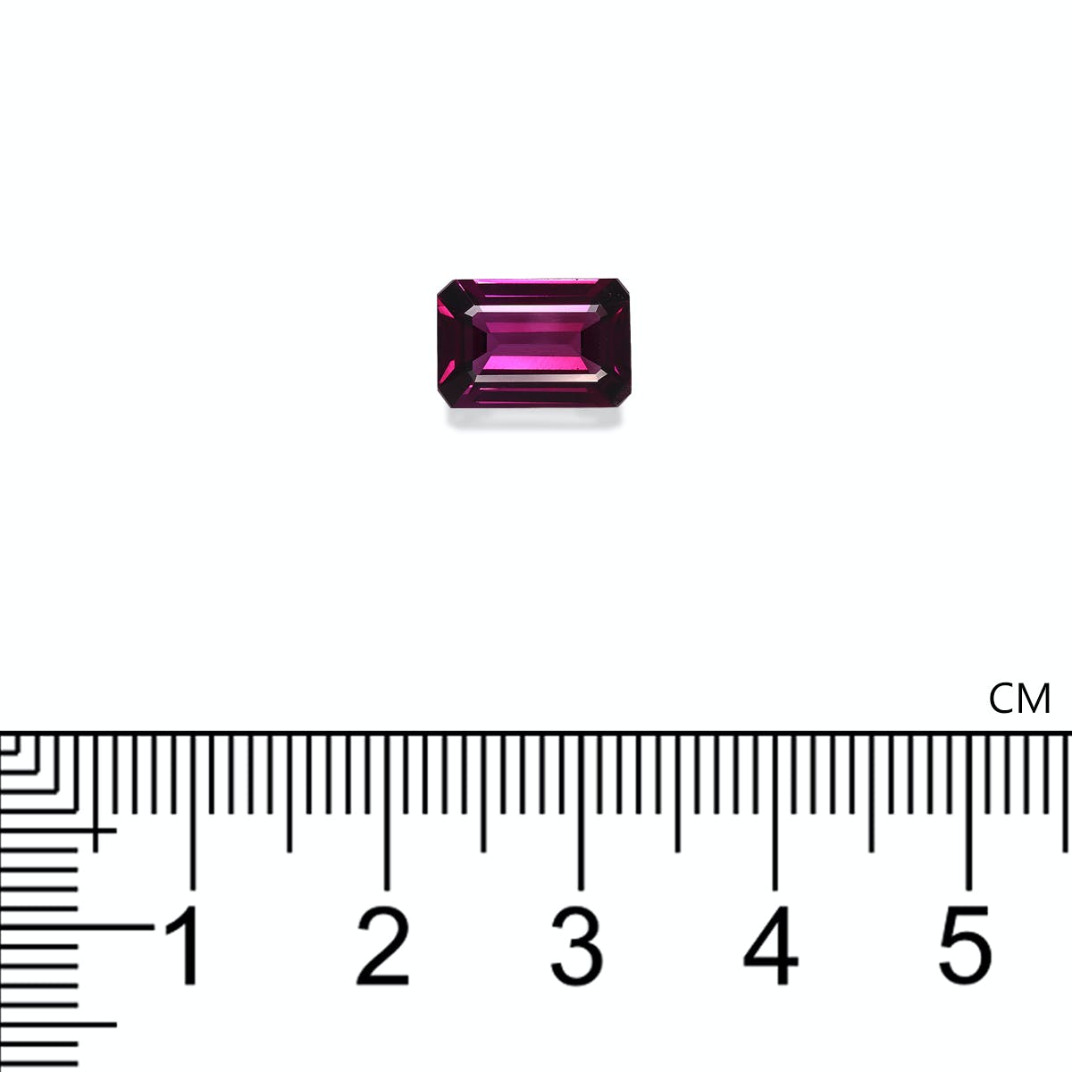 Une pierre précieuse Grenat Umbalite, 2,66 ct de Bonnot Paris, est présentée sur un fond blanc à côté d'une règle centimétrique, révélant sa longueur légèrement supérieure à 1 cm.