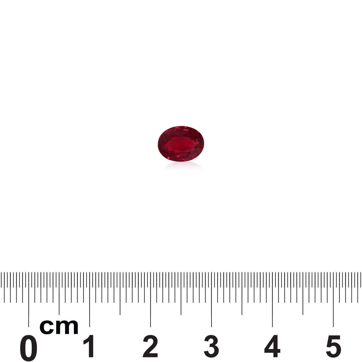 Un Rubis du Mozambique de 1,52 carat de Bonnot Paris, de forme ovale et rouge, est présenté sur une surface blanche avec une règle indiquant que sa taille est d'un peu moins de 1 cm de long.
