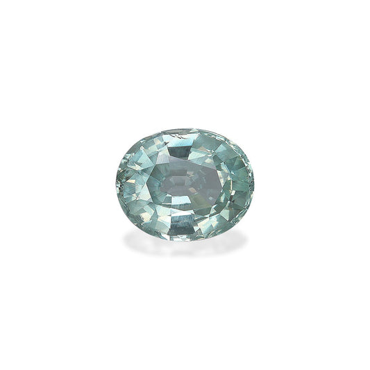 Gros plan sur une alexandrite ronde et polie de Bonnot Paris. Cette pierre de 2,31 carats présente une teinte bleu-vert clair avec des facettes complexes reflétant la lumière pour un effet scintillant sur un fond blanc uni.
