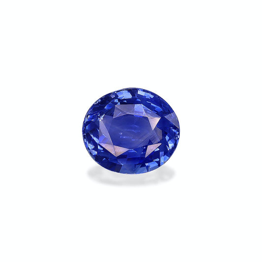 Le Saphir Bleu · 2,27ct de Bonnot Paris est une pierre précieuse bleue de forme ovale à facettes, reposant sur une surface claire et projetant une ombre subtile en dessous.