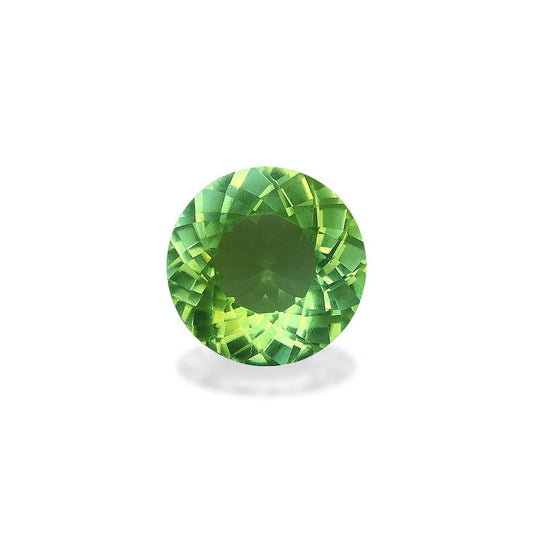 La Tourmaline Paraïba Bonnot Paris · 7,2 ct, une pierre précieuse verte ronde et facettée aux motifs complexes, est présentée sur un fond blanc uni, projetant une légère ombre en dessous.