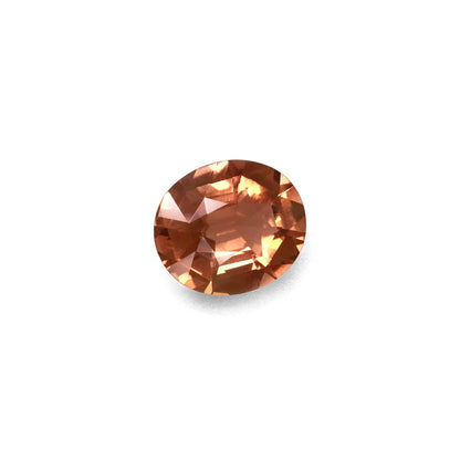 Une pierre précieuse brune facettée de 6,68 carats, de forme ovale, présentée sur un fond blanc uni. Les reflets et les reflets rehaussent sa clarté et sa couleur. Marque : Bonnot Paris ; Produit : Tourmaline jaune.