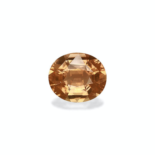 Une Tourmaline Jaune facettée de forme ovale de couleur champagne de 6,68 ct de Bonnot Paris est présentée sur un fond gris clair, mettant en valeur ses multiples tailles étincelantes et réfléchissantes.