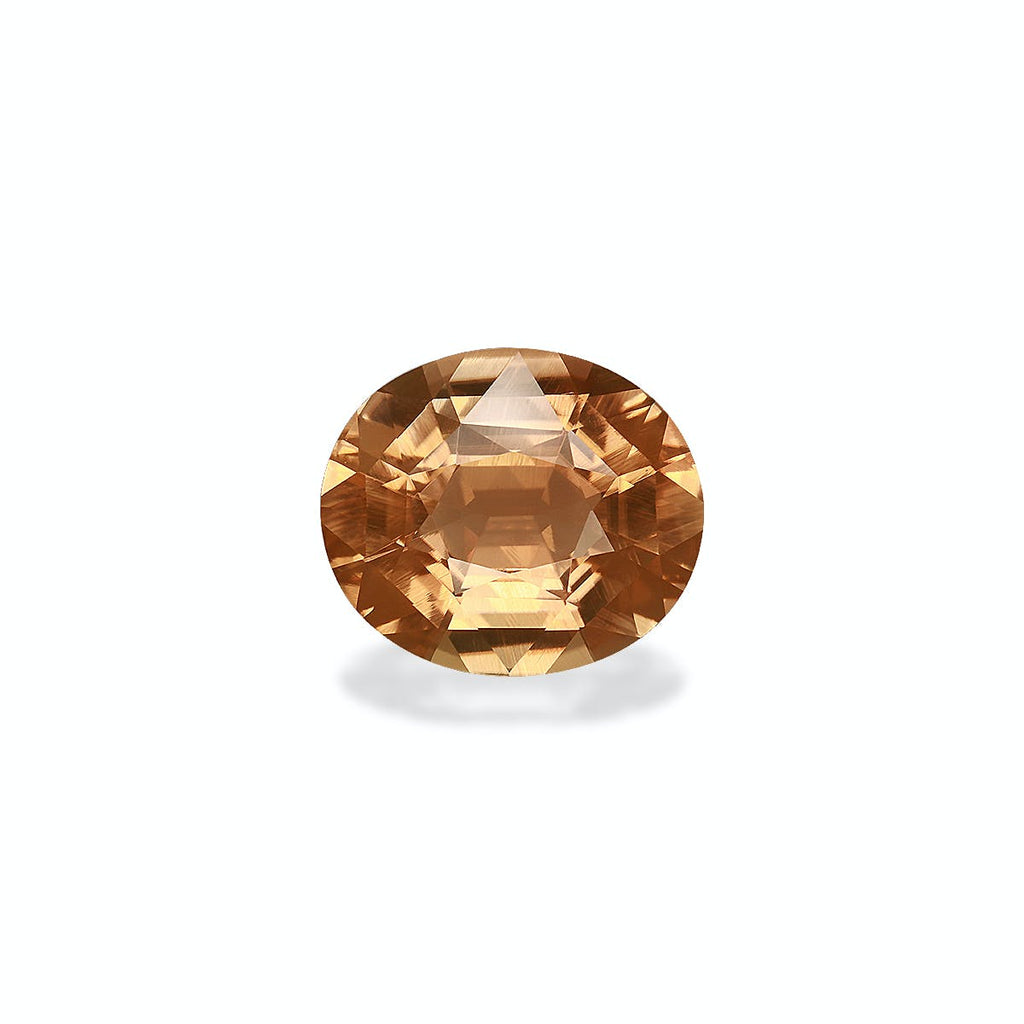 Une Tourmaline Jaune facettée de forme ovale de couleur champagne de 6,68 ct de Bonnot Paris est présentée sur un fond gris clair, mettant en valeur ses multiples tailles étincelantes et réfléchissantes.
