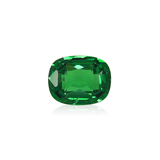 Bonnot Paris présente le Grenat Tsavorite, une pierre précieuse verte profonde polie de 1,7 carat avec une taille coussin, présentée sur un fond blanc.