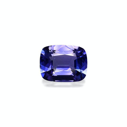 Une pierre précieuse Tanzanite taille coussin de 6,66 ct de Bonnot Paris présente une riche teinte bleu-violet, reflétant la lumière sur un fond uni.
