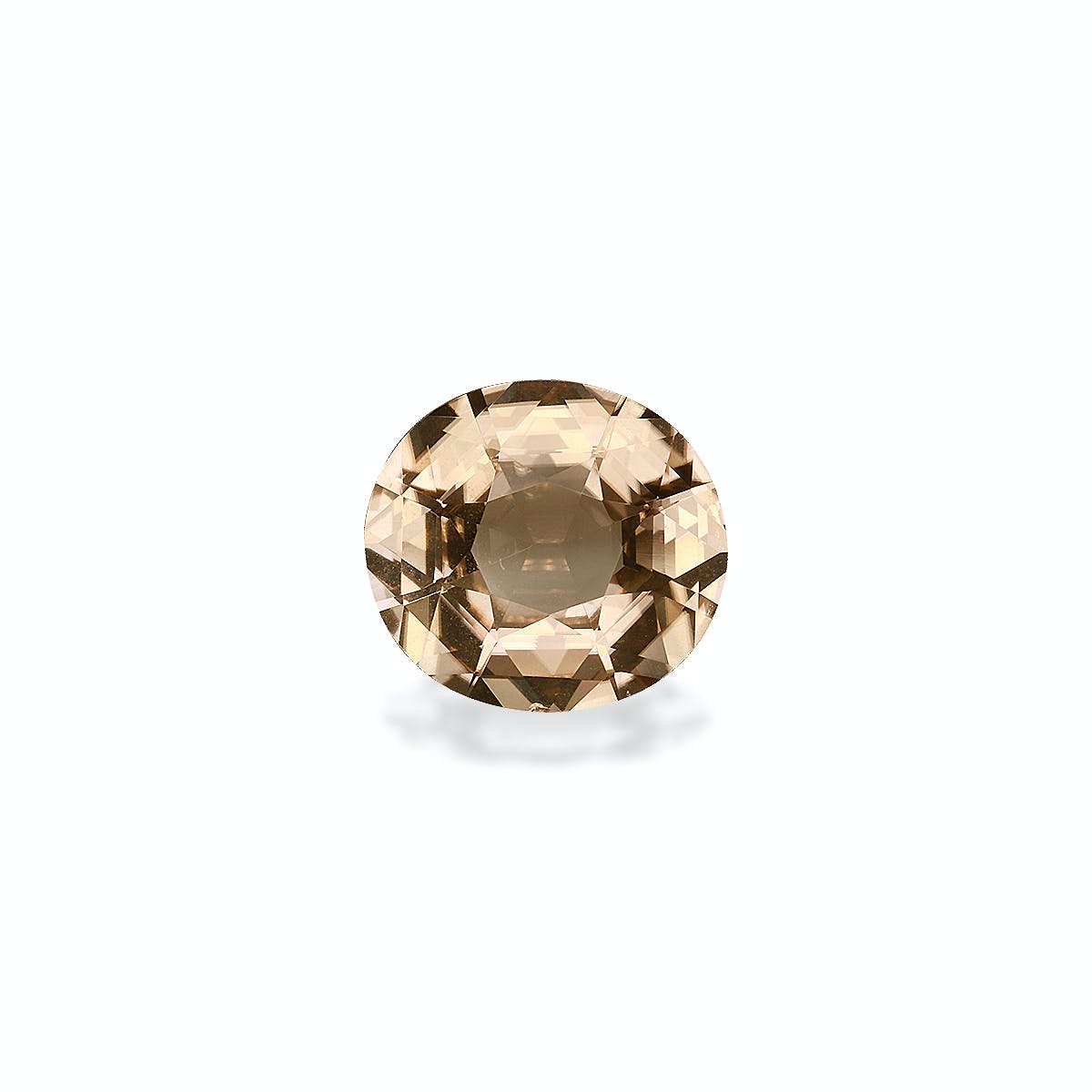 La Tourmaline Jaune de Bonnot Paris est une pierre précieuse ronde facettée de 5,98 carats, d'une teinte brun clair, posée sur un fond gris clair uni. Elle scintille subtilement, projetant une ombre subtile en dessous.