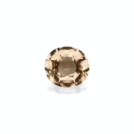 La Tourmaline Jaune de Bonnot Paris est une pierre précieuse ronde facettée de 5,98 carats, d'une teinte brun clair, posée sur un fond gris clair uni. Elle scintille subtilement, projetant une ombre subtile en dessous.