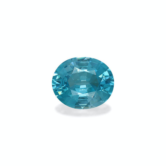 Le Zircon Bleu · 7,65 ct de Bonnot Paris est une pierre précieuse bleue vibrante de taille ovale présentée sur un fond blanc uni avec une légère ombre en dessous.